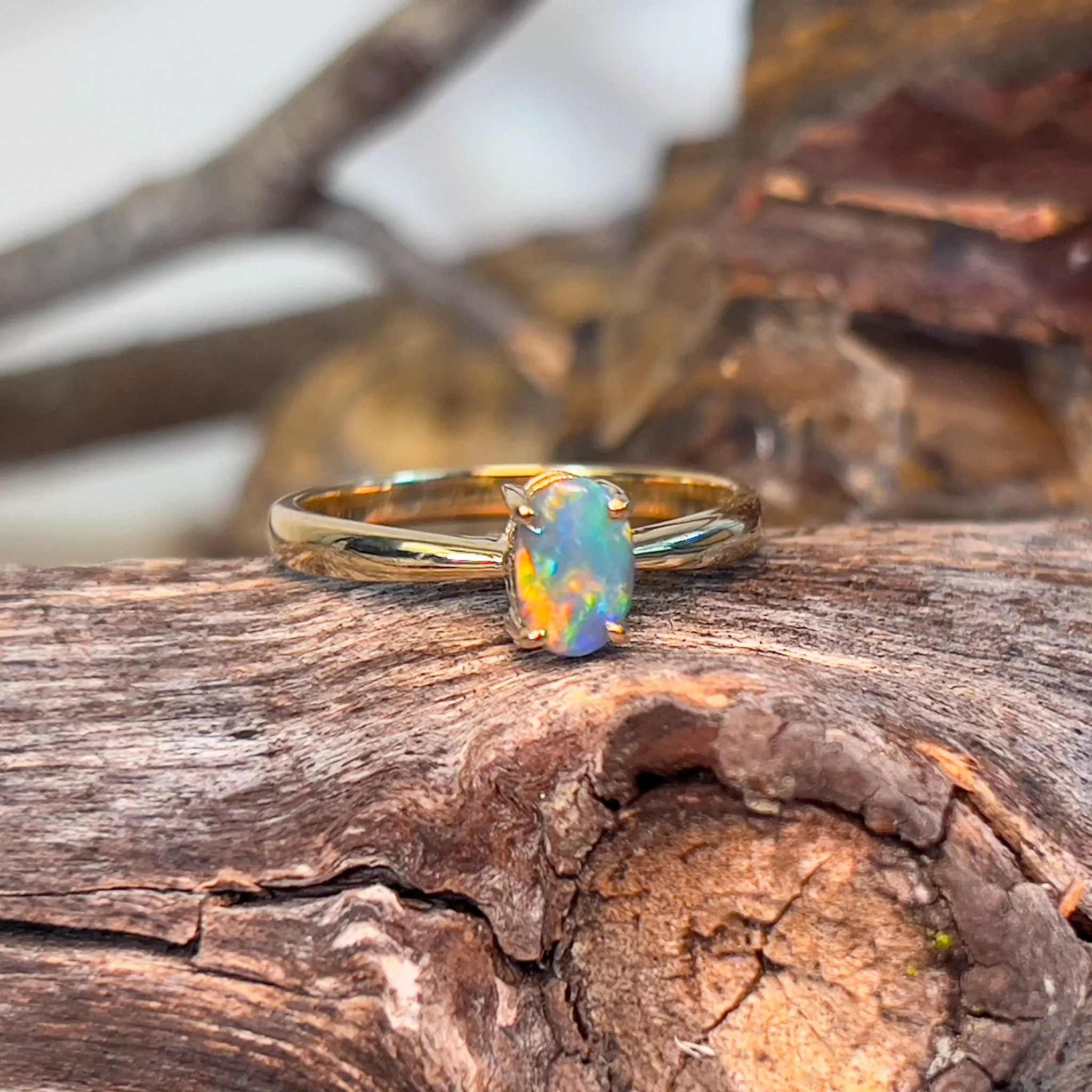 14kt Yellow Gold solitaire ring with one 0.49ct Black Opal