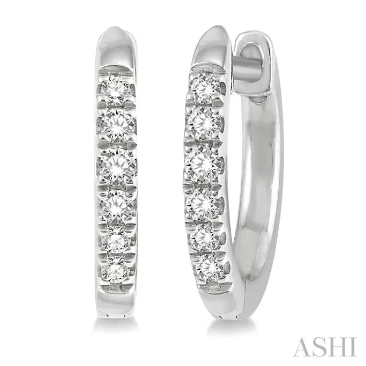 1/8 Ctw Round Cut Diamond Huggie Earrings in 10K White Gold