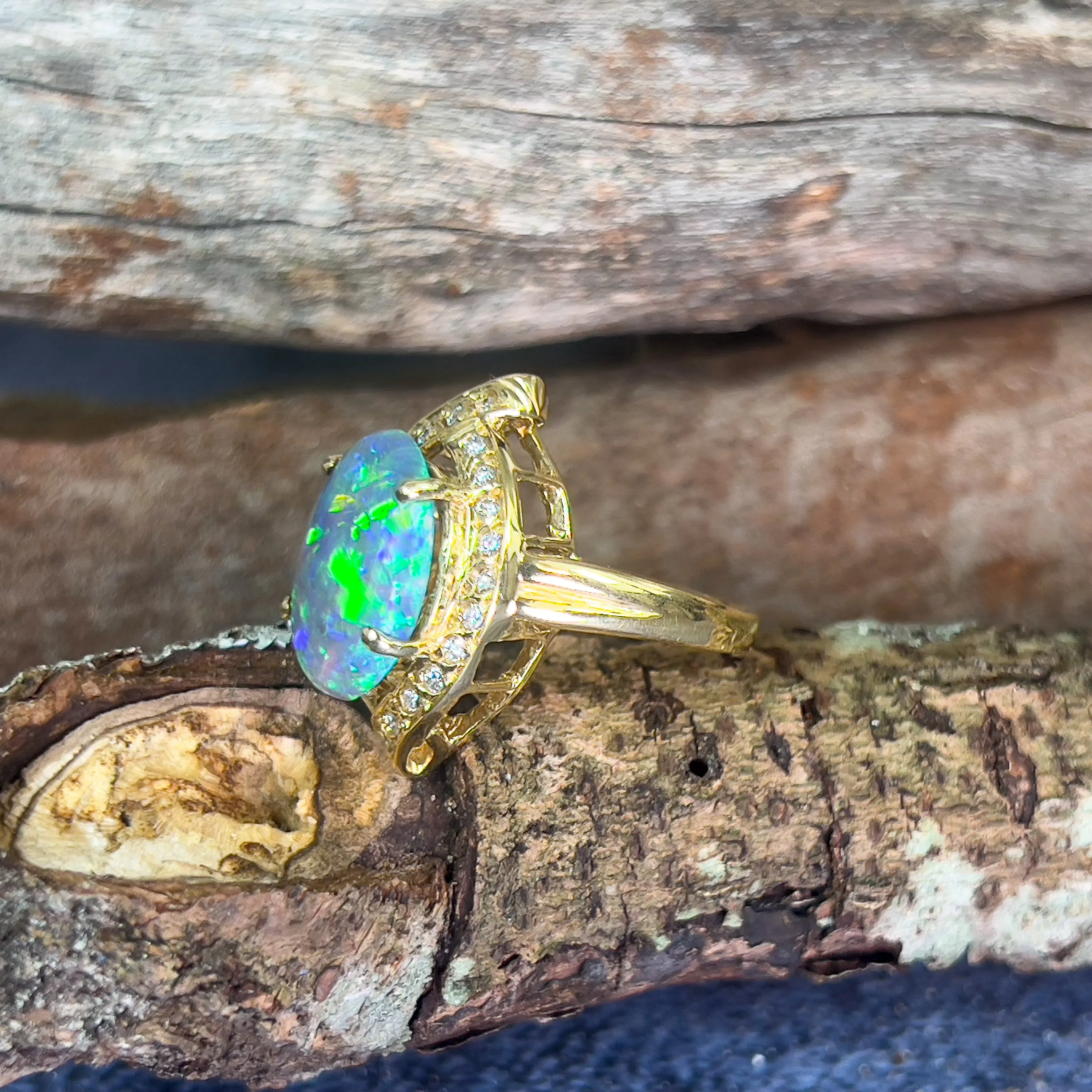 18kt Yellow Gold Black Opal 4ct Green Blue and diamond ring