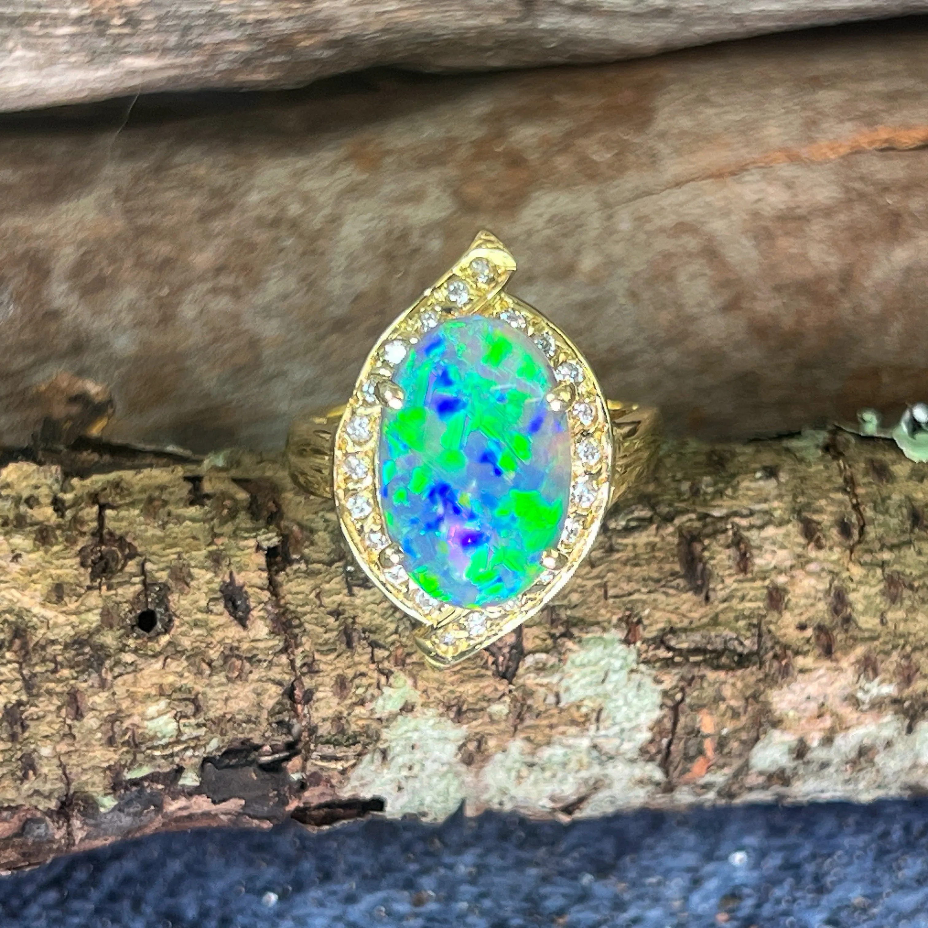 18kt Yellow Gold Black Opal 4ct Green Blue and diamond ring