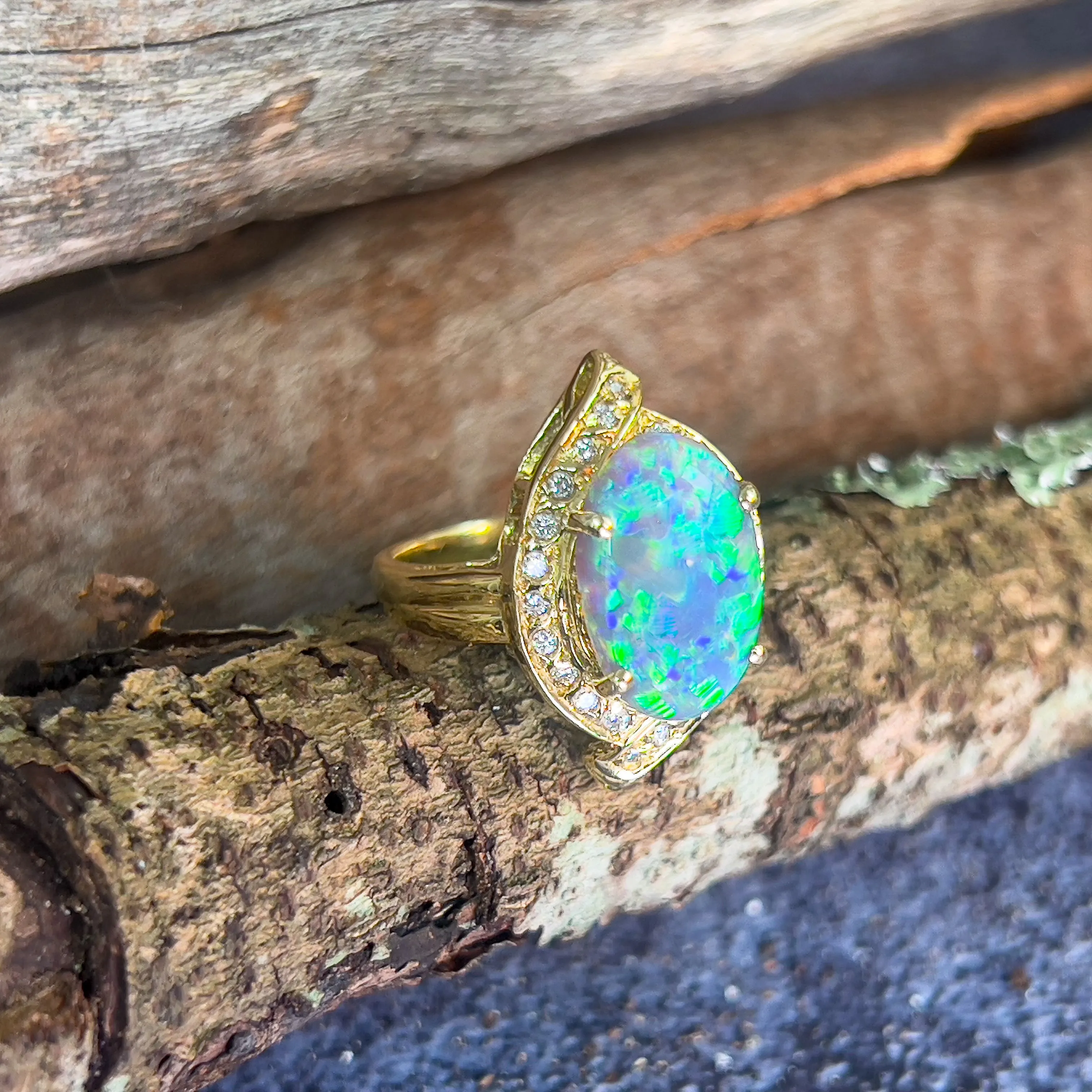 18kt Yellow Gold Black Opal 4ct Green Blue and diamond ring