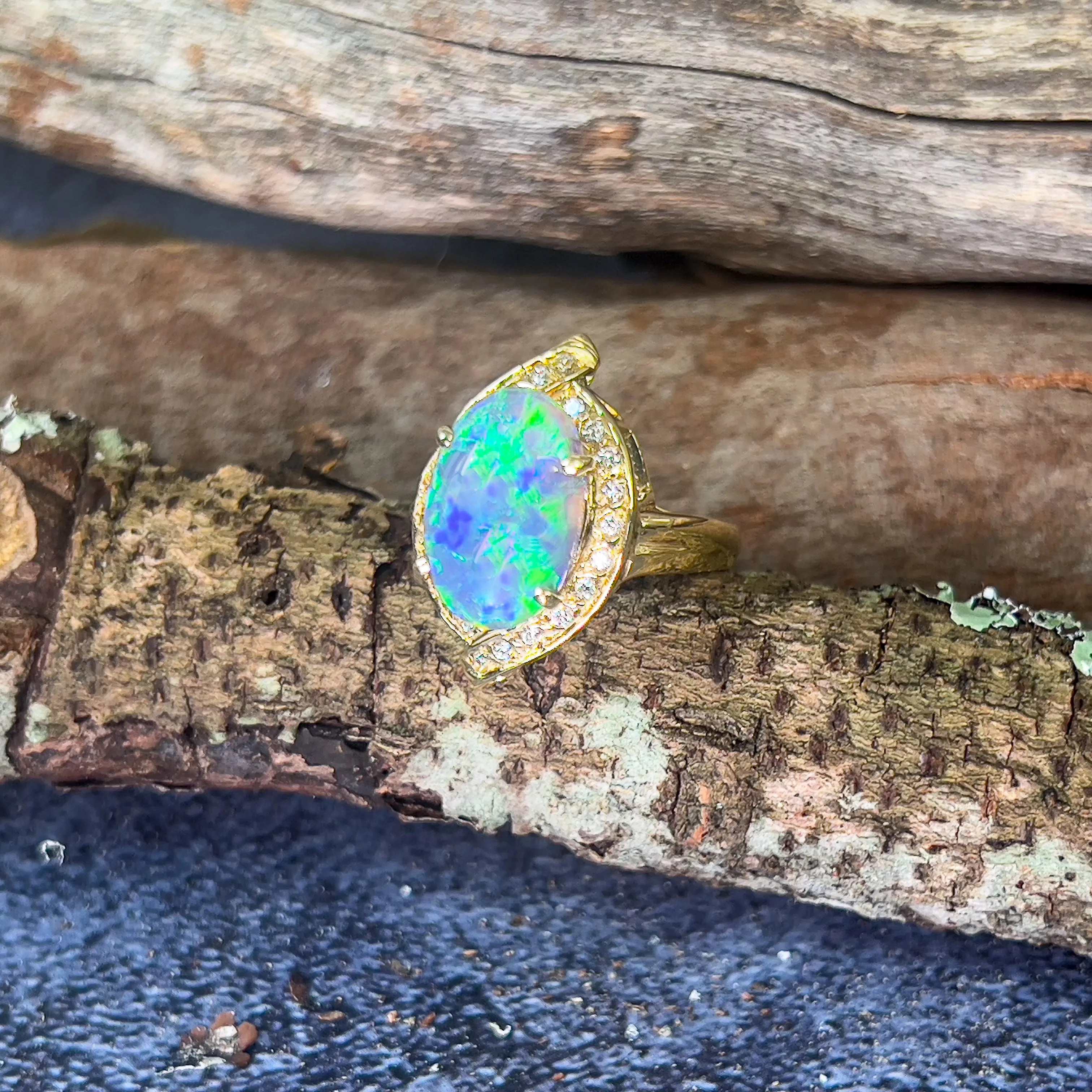 18kt Yellow Gold Black Opal 4ct Green Blue and diamond ring