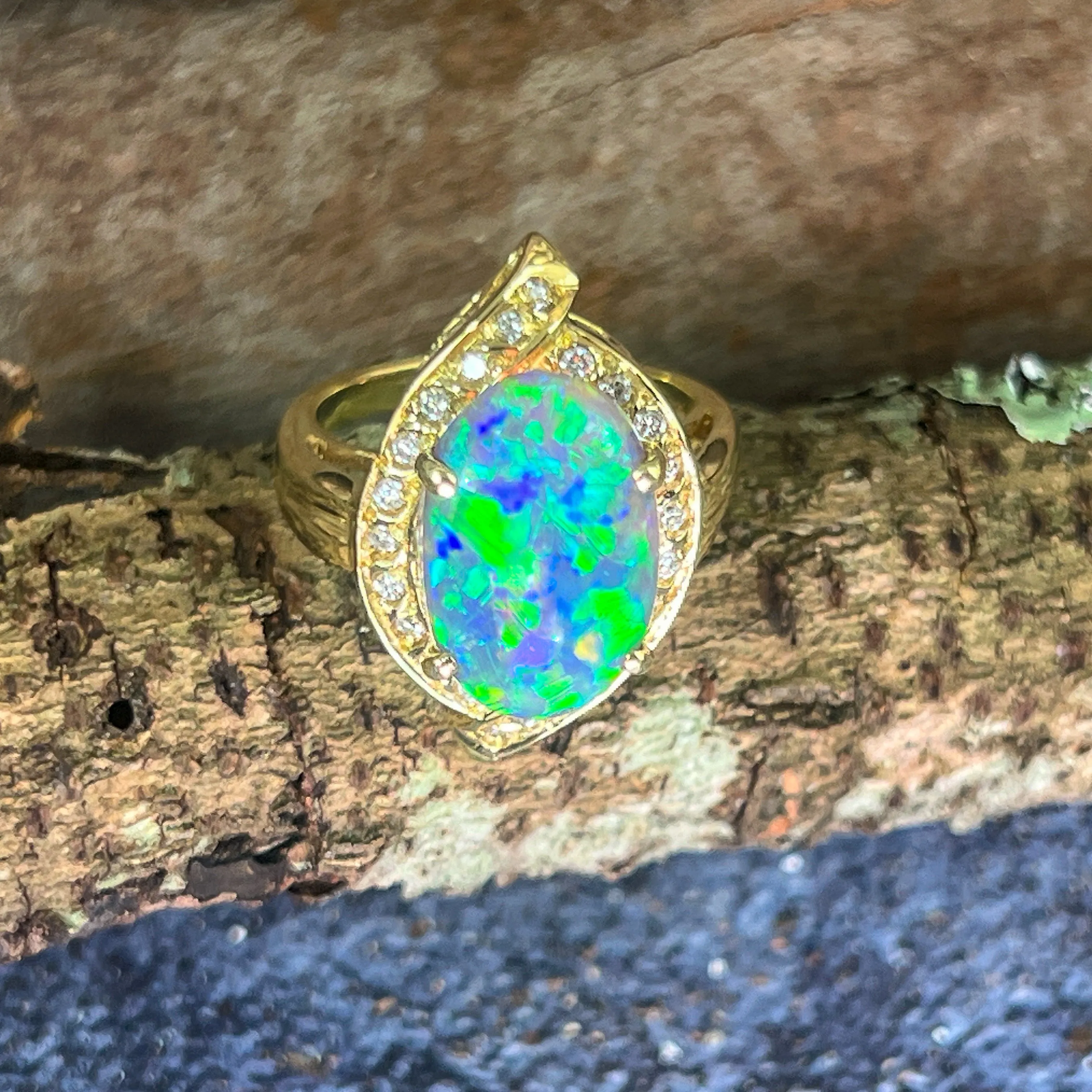 18kt Yellow Gold Black Opal 4ct Green Blue and diamond ring