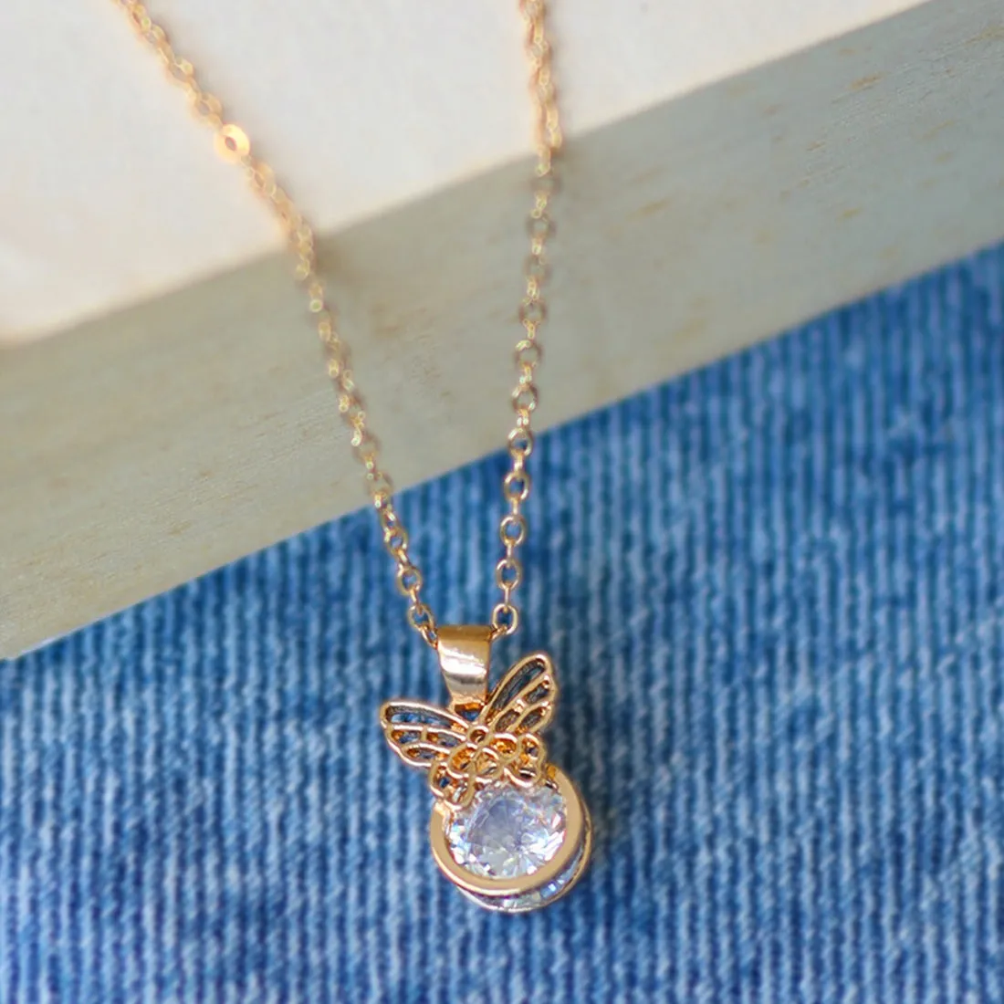 Butterfly Pendant Necklace with Circular Diamante Stud Gold-Toned Mini Pendant Necklace